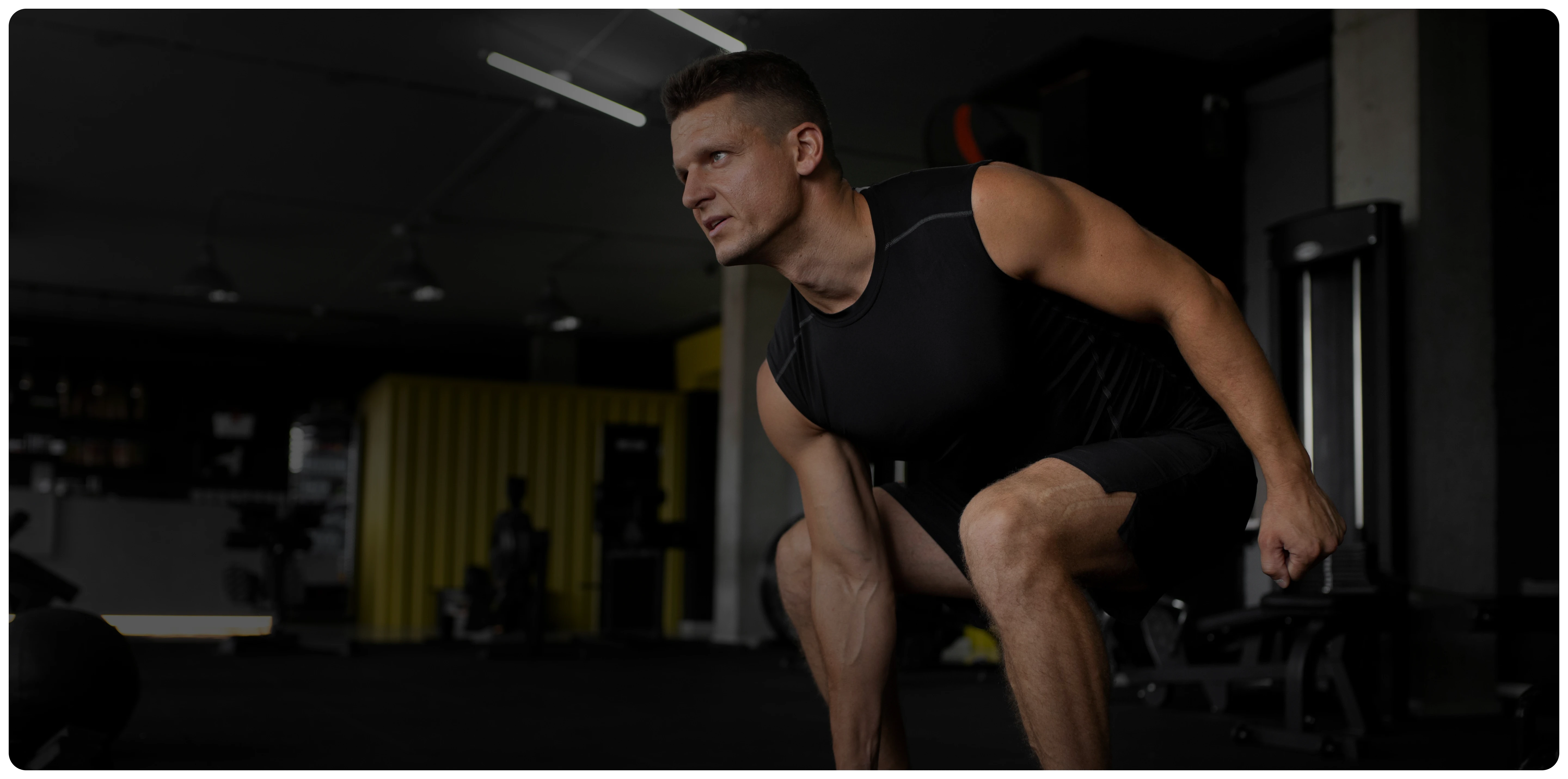 Prime Clinics client performing a dumbbell deadlift in the training studio
