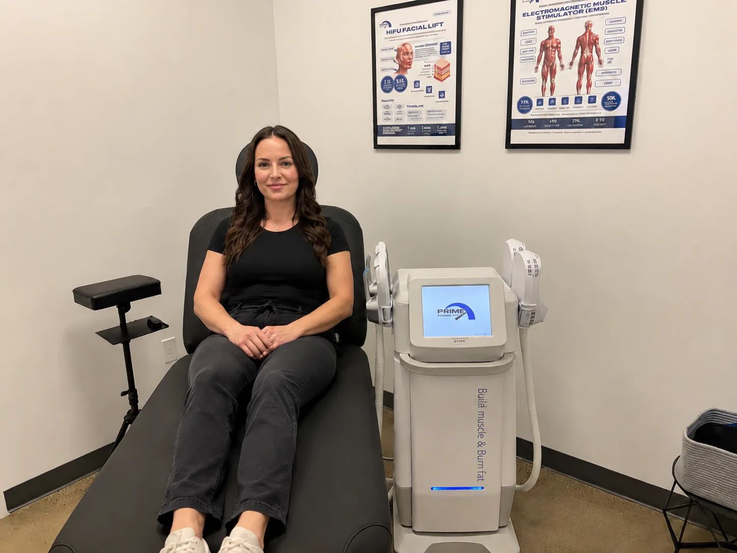 A patient seated beside the Fotona StarFormer Pro in a Prime Clinics treatment room